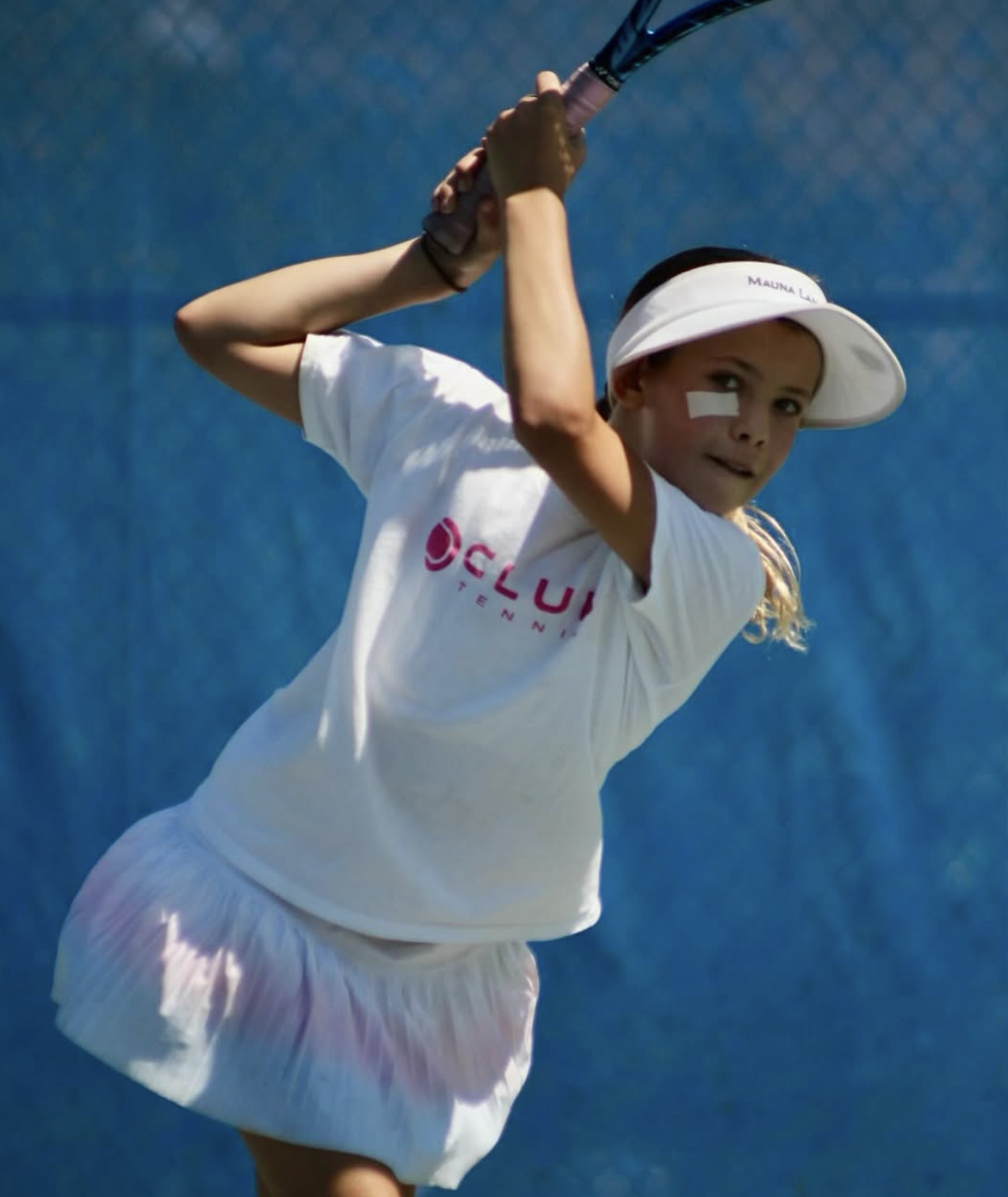 Club Tennis player celebrating win on blue court